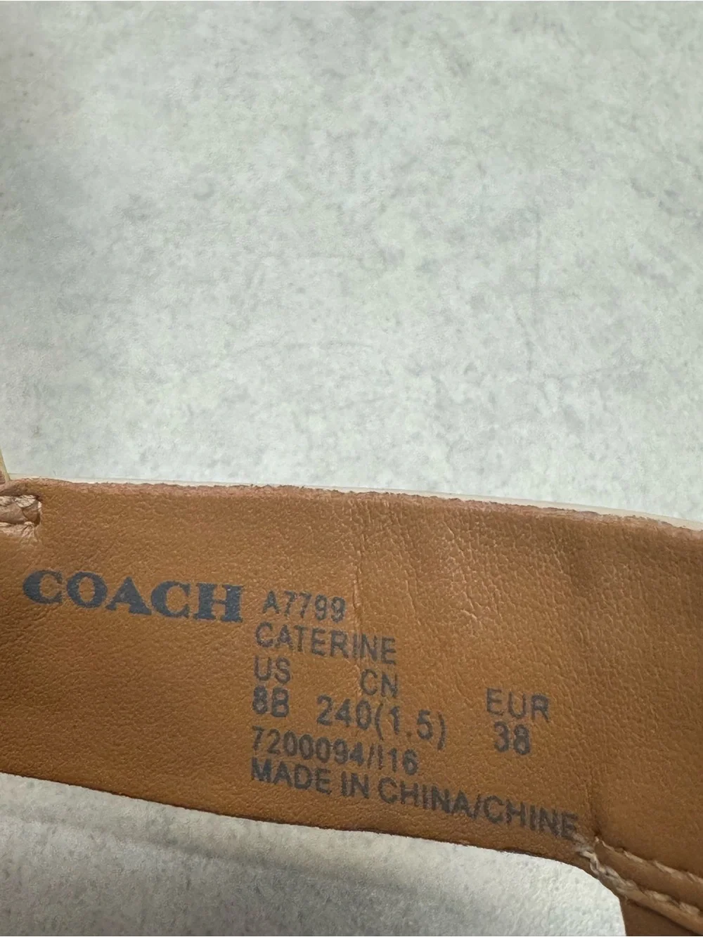 Coach Ivory Patent Leather T‑Strap Sandals with Gold Plaque